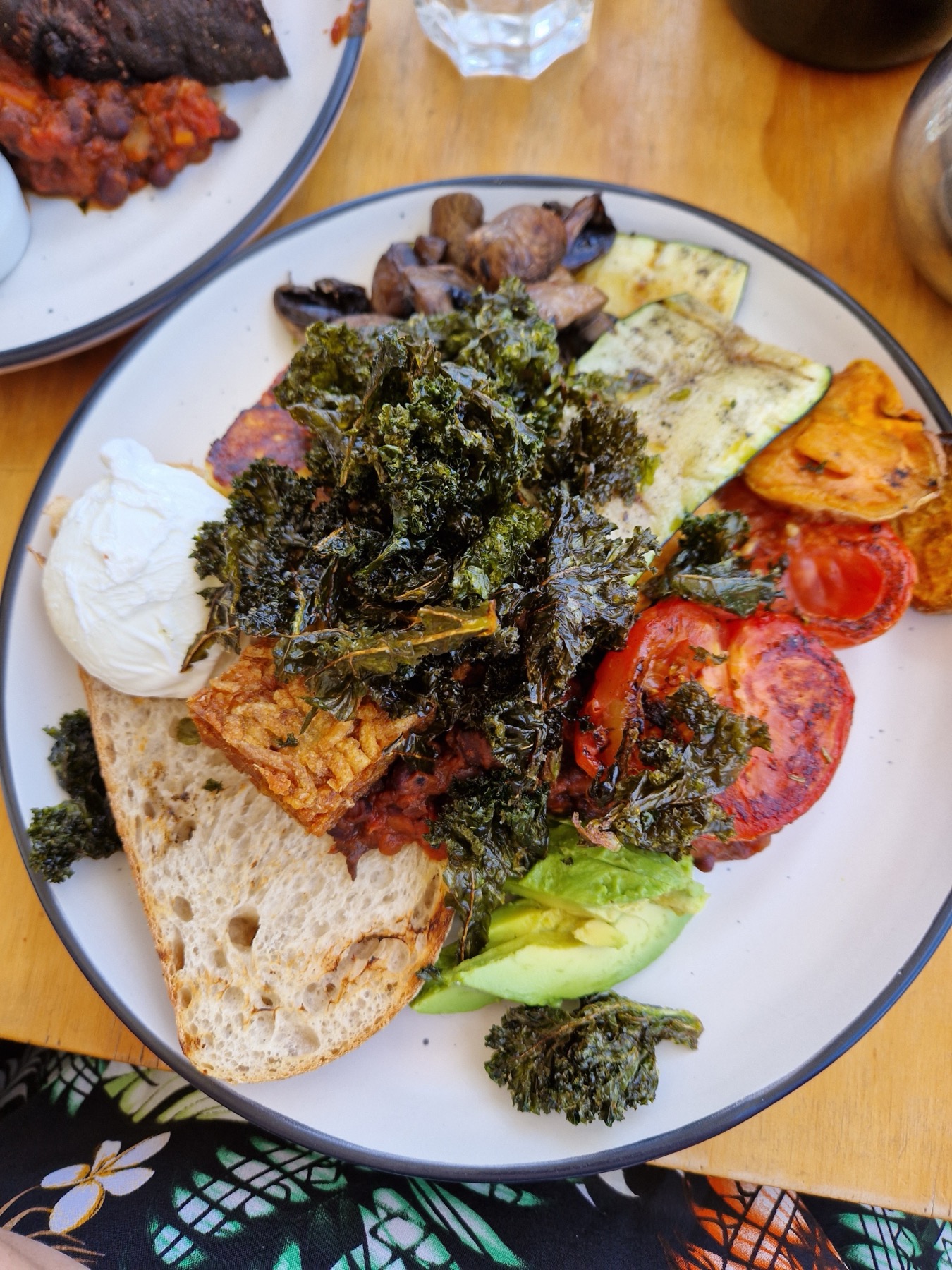 Roasted vegetables with kale, avocado and toasted seeds